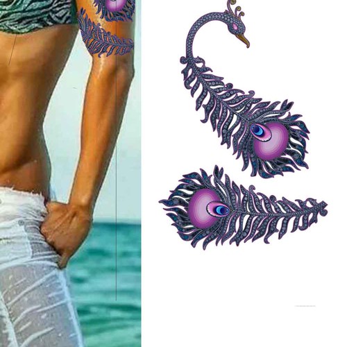 Peacock design with the title 'A Peacock as Tattoo on my Arm'