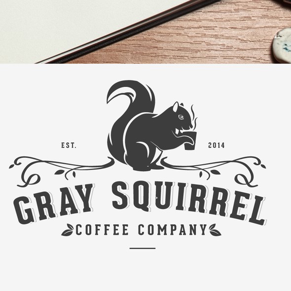 Squirrel logo with the title 'Logo for a small batch artisan coffee roasting company.'