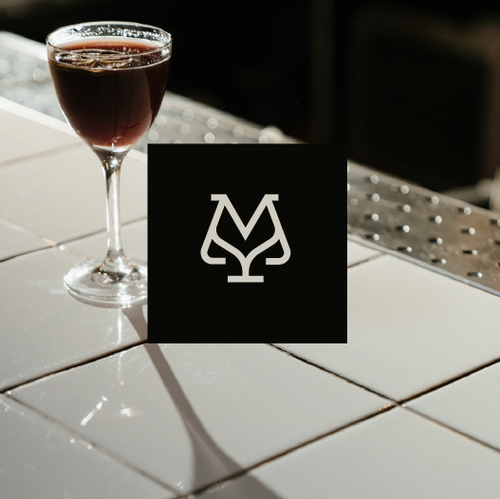 M logo with the title 'VINO MONDIAL'