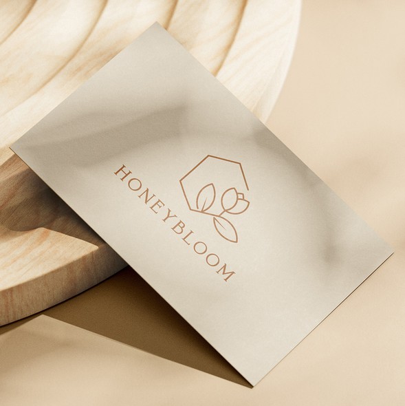 Bloom design with the title 'Minimalistic feminine logo for a startup maternity store supporting women'