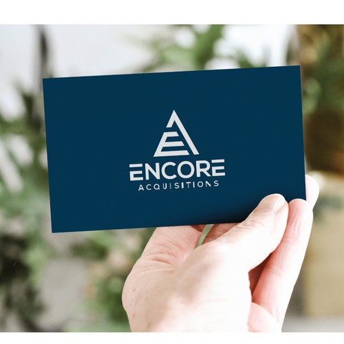 Stationery logo with the title 'ENCORE LOGO DESIGN'