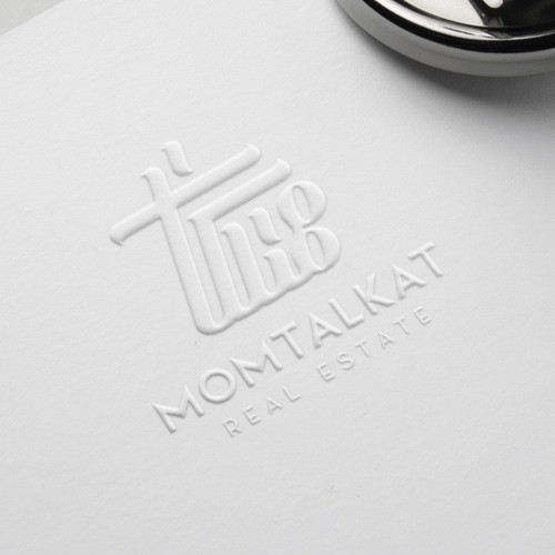 Qatar logo with the title 'Momtalakat'