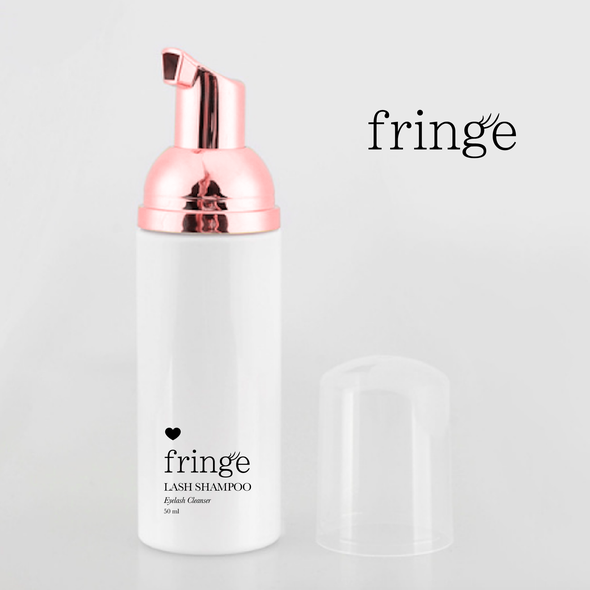 Girly packaging with the title 'Fringe | Lash Shampoo'