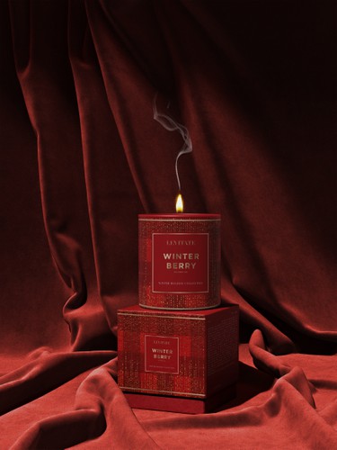 Candle packaging with the title 'Levitate Christmas Candles'