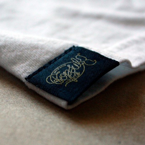 Brush pen design with the title 'Logo concept for surf-inspired clothing company'