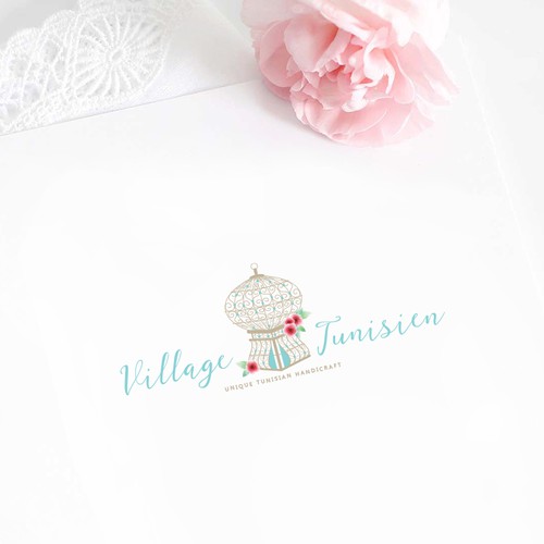 Flower logo with the title 'Village Tunisien'
