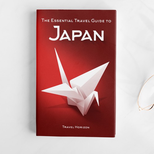 Origami design with the title 'The Essential Travel Guide to Japan'