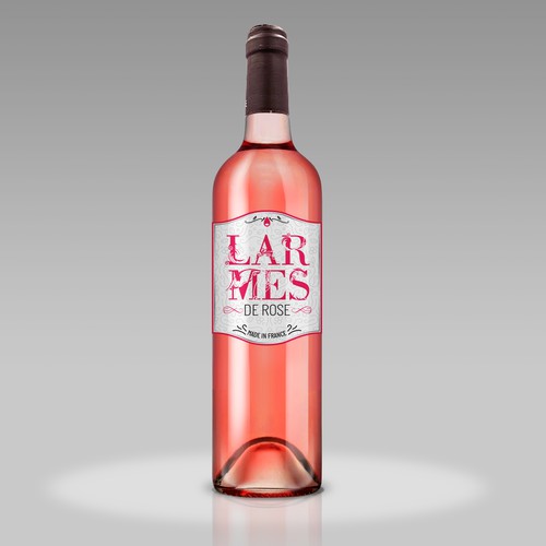 Pink label with the title 'LARMES DESIGN'