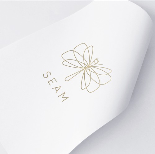 Dragonfly design with the title 'Unique Seam logo design depicting dragonfly made out of needle and thread.'