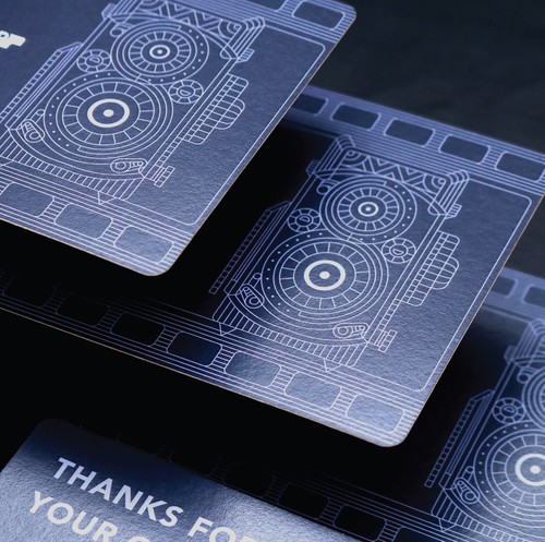 Camera design with the title 'Oldcamshop Postcard.'