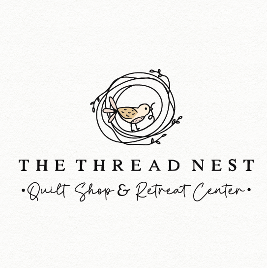 Quilting logo with the title 'the thread nest'