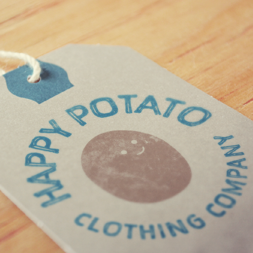 Tag design with the title 'Happy Potato Clothing Company'
