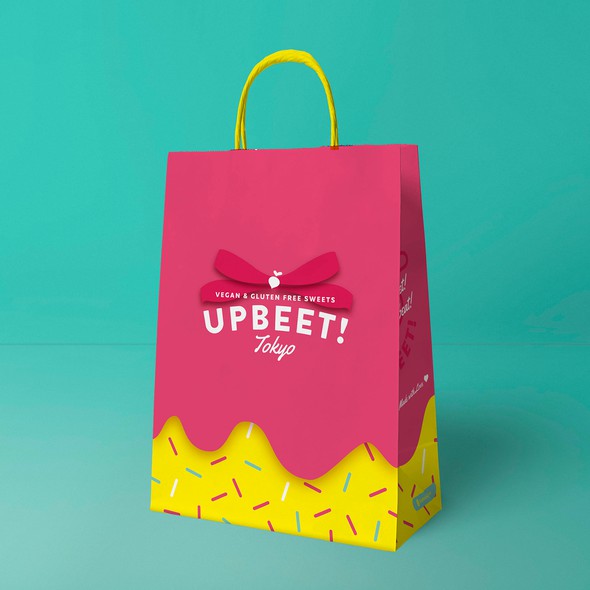 Yellow and pink design with the title 'pop urban logo for a modern sweet cake shop'