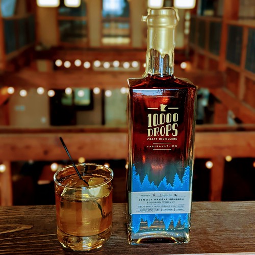 Bottle packaging with the title '10,000 Drops Bourbon Bottle Design'