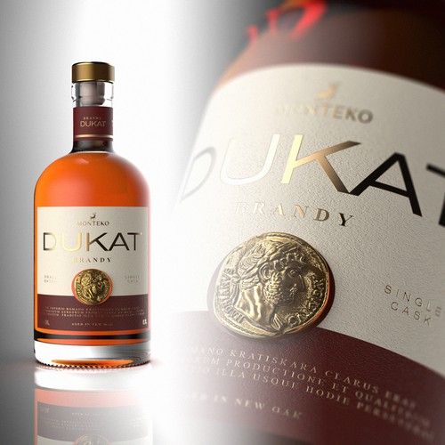 Gold label with the title 'DUKAT Brandy Packaging and Label design'