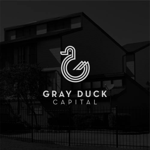 Duck hunting logo with the title 'Logo for a real estate company Gray Duck'
