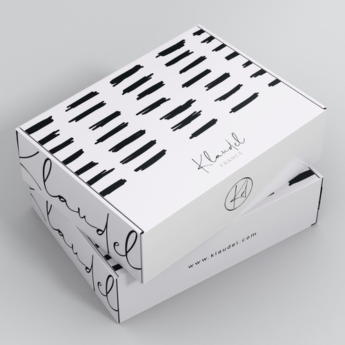 Gift packaging with the title 'Creates a modern design for our French designer clothing packaging'