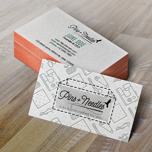 Embossed design with the title 'Pins + Needles Business Card Design Entry'