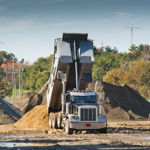 AdobeStock_dump truck dumping.jpeg