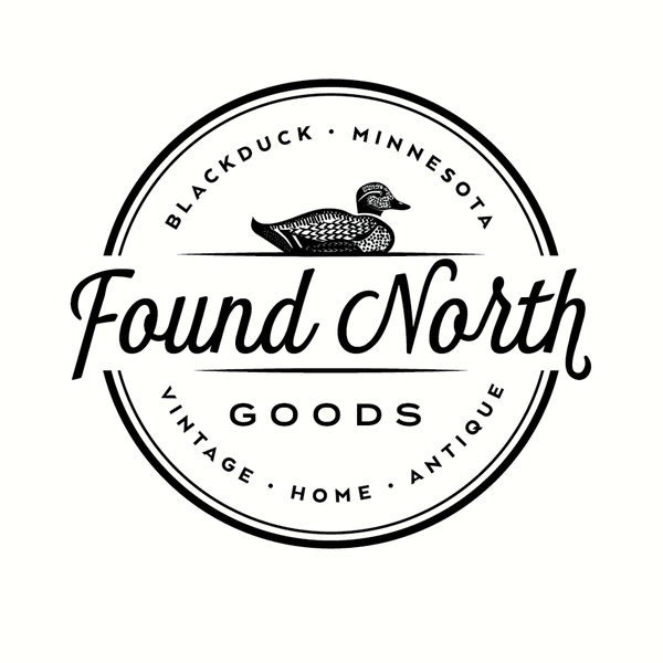Design by green in blue titled "Logo design for a vintage home boutique called Found North Goods"