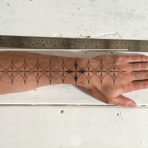 Designs Design a functional tattoo for Ben Uyeda that turns his arm