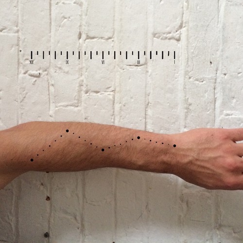 Design a functional tattoo for Ben Uyeda that turns his arm into a