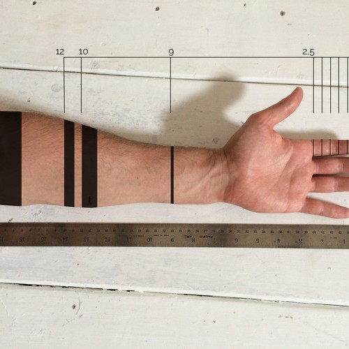 Design a functional tattoo for Ben Uyeda that turns his arm into a ruler Design by Olivier Laporte