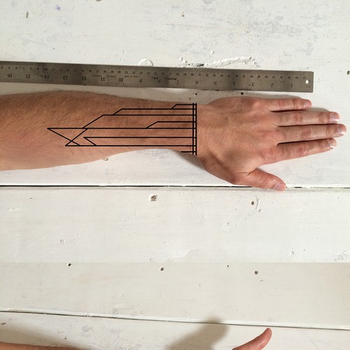 Design a functional tattoo for Ben Uyeda that turns his arm into a ruler Design by wanbe