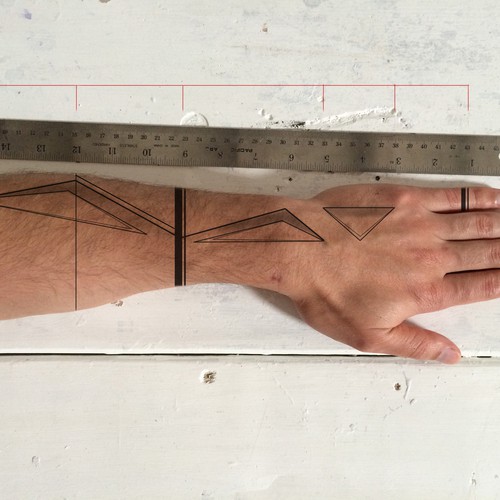 Design a functional tattoo for Ben Uyeda that turns his arm into a ruler Design by LilithSah